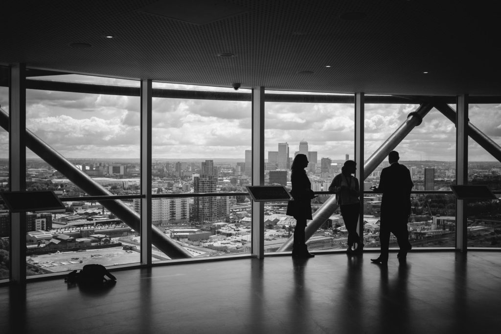 Business discussion overlooking city skyline